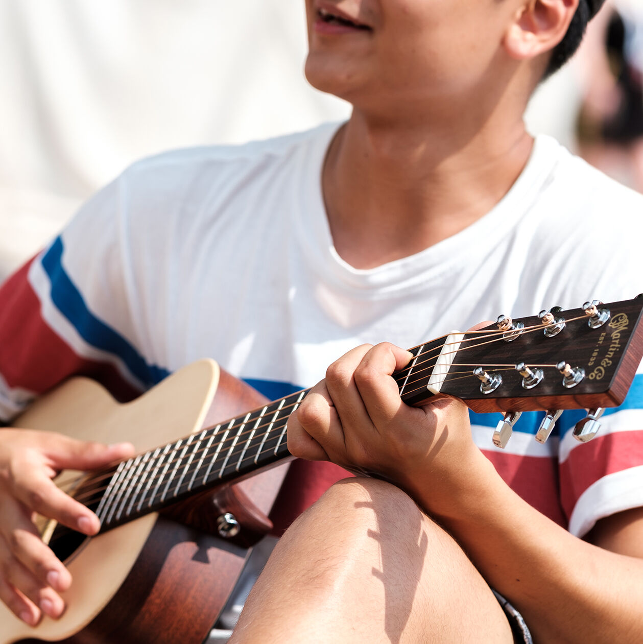 Person playing a guitar